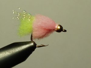A little chum bug fly fishing lure, freshly tied and ready for action.